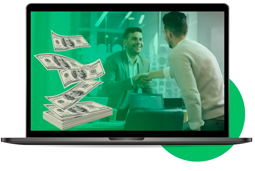 Business partners shaking hands over a desk covered with cash